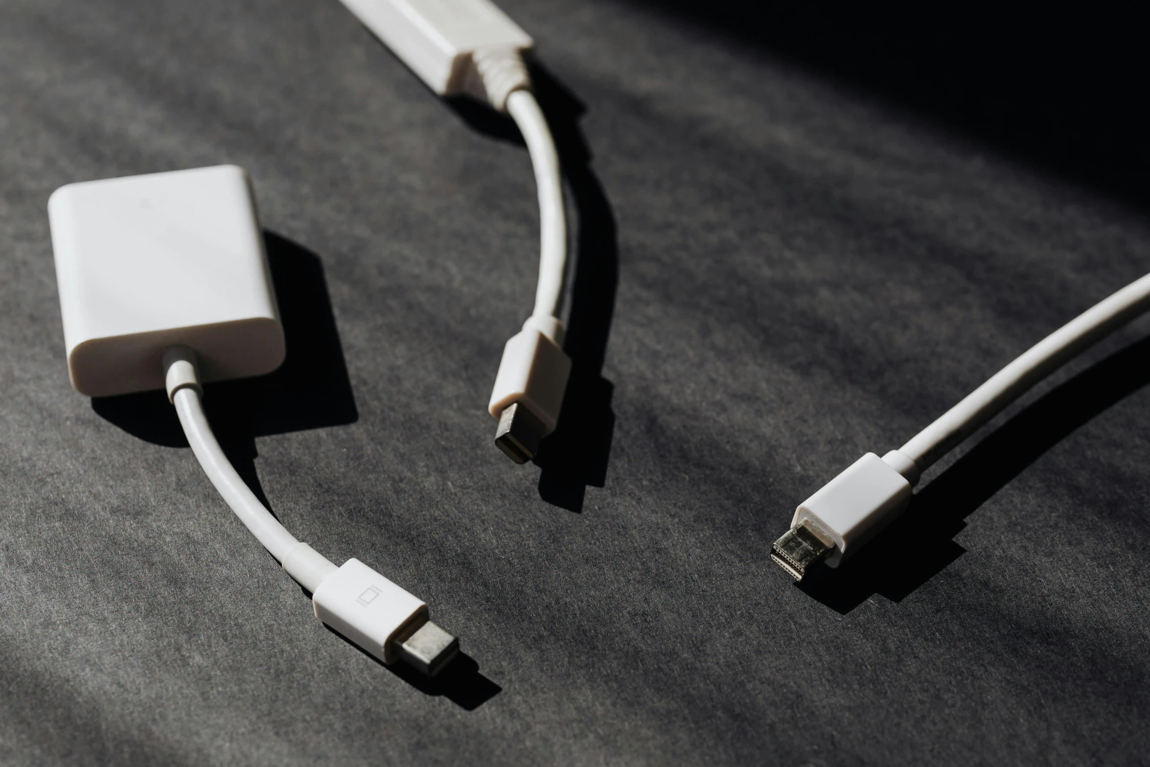 a couple of cables sitting on top of a table, trending on pexels, white on black, usb ports, opaque, jets