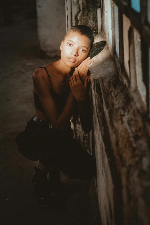 a woman leaning against a wall next to a window, pexels contest winner, willow smith young, maria borges, dark ballerina, location ( favela _ wall )