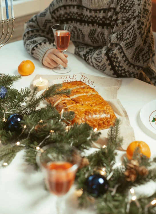 a woman sitting at a table with a plate of food, holiday vibe, orange reflective puffy coat, single pine, thumbnail