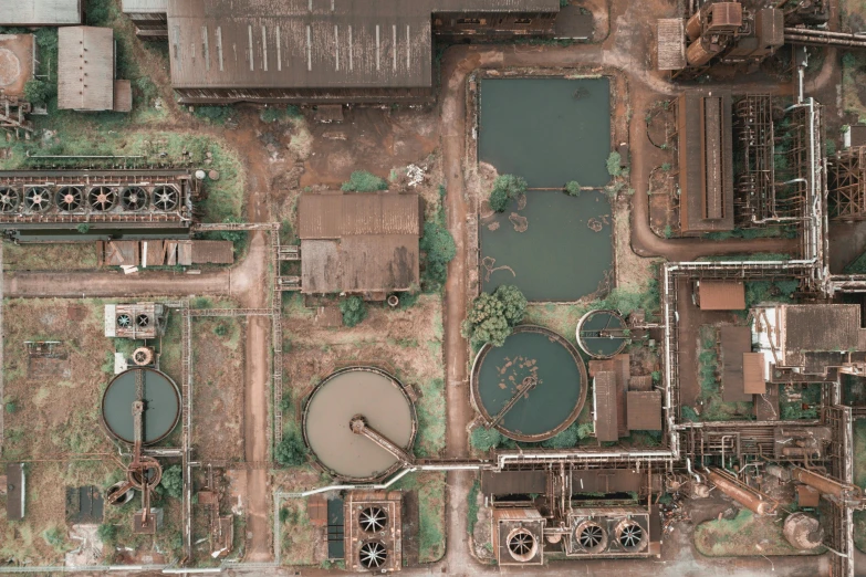 an aerial view of a large industrial plant, an album cover, pexels contest winner, renaissance, dirty water, brown, photogrammetry, 15081959 21121991 01012000 4k
