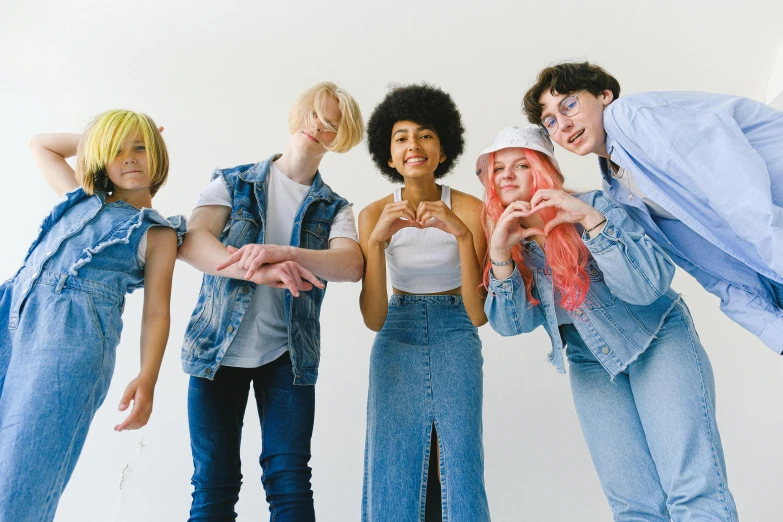 a group of young people standing next to each other, by Ellen Gallagher, trending on pexels, antipodeans, albino hair, denim, diverse costumes, rex orange county