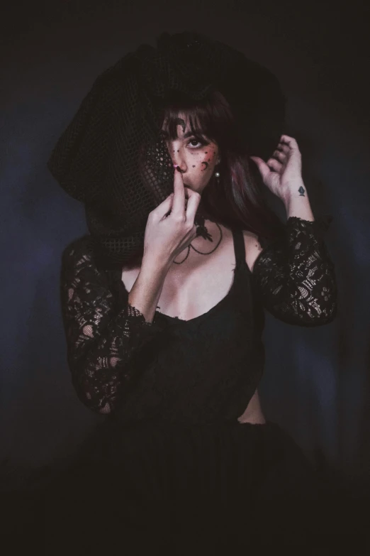 a woman in a black dress and a black hat, inspired by Elsa Bleda, pexels contest winner, gothic art, melanie martinez, with a covered face, witchcore clothes, seductive lady