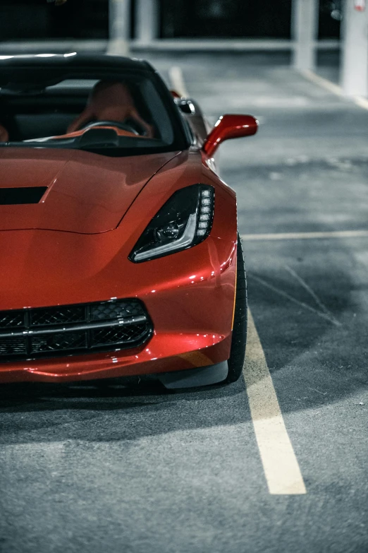 a red sports car parked in a parking lot, pexels contest winner, photorealism, front lighting, stingray, ultra high resolution, instagram photo