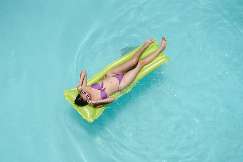 a woman laying on an inflatable raft in a pool, a picture, lime green, 2 colours, hanging, rectangular