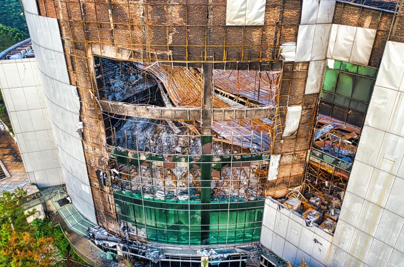 an aerial view of a building under construction, a mosaic, pexels contest winner, renaissance, burnt, glass and steel, promo image, deteriorated