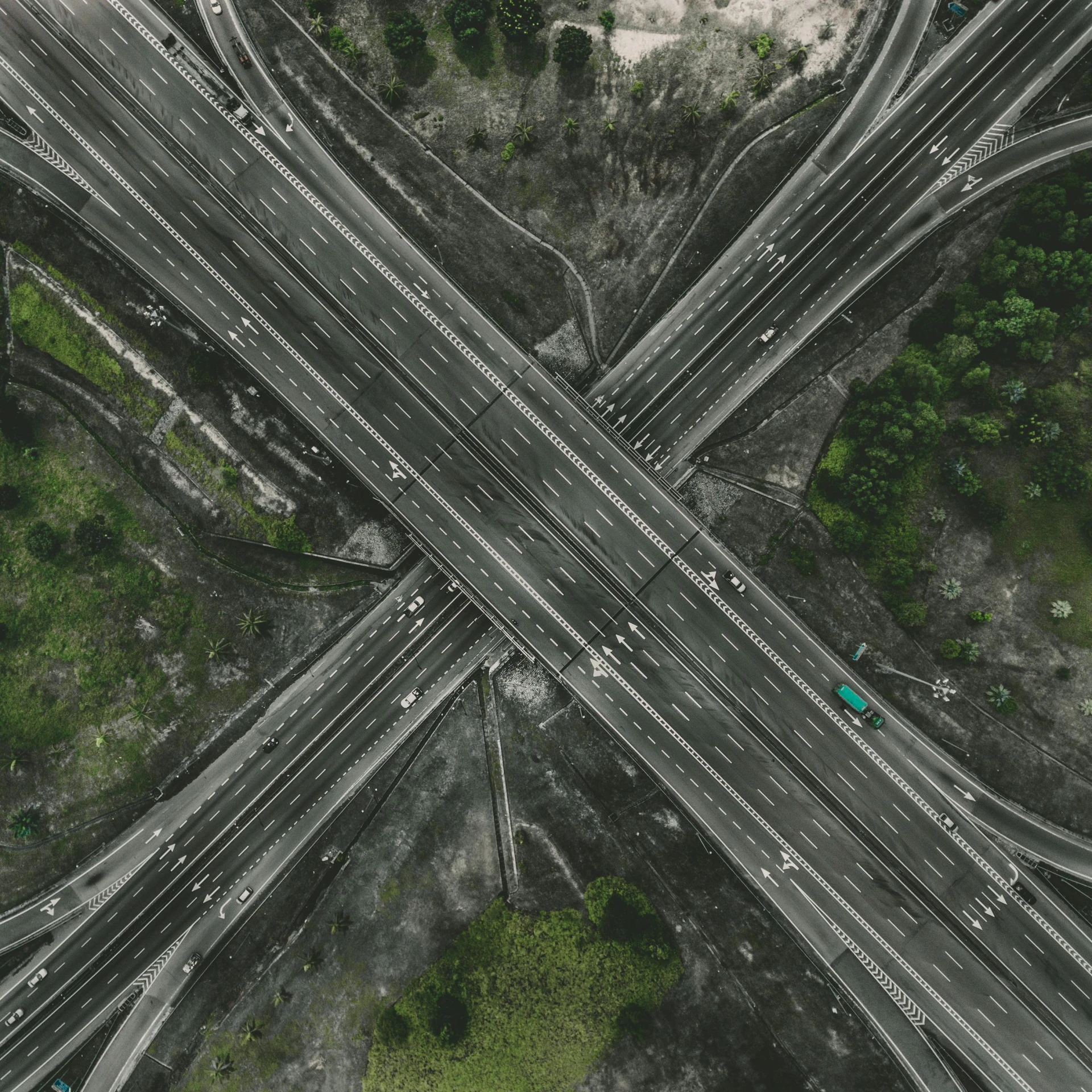 an aerial view of a highway intersection, an album cover, pexels contest winner, realism, grey, a green, multiple stories, destructive