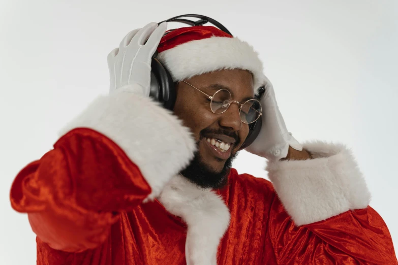 a man in a santa suit talking on a cell phone, an album cover, pexels, hurufiyya, gaming headset, black man, thumbnail, blippi