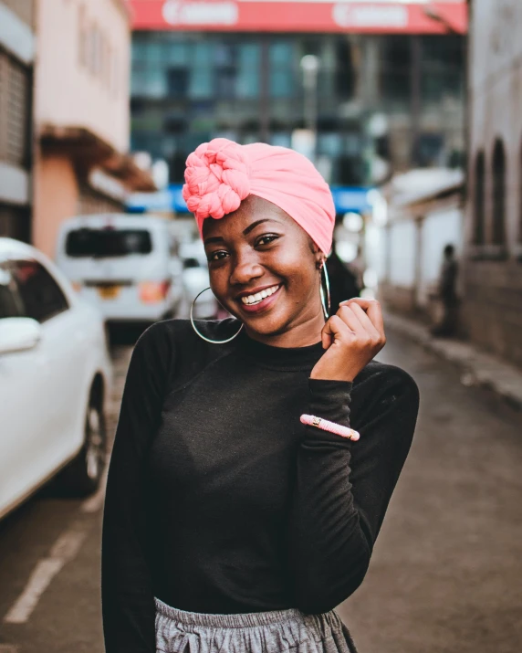 a woman in a pink turban standing on a city street, pexels contest winner, happening, black girl, smiling :: attractive, unmistakably kenyan, transparent background