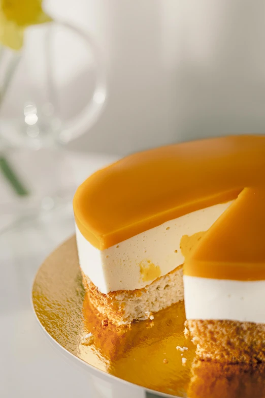 a cake with a slice taken out of it, inspired by Charles Le Roux, unsplash, mango, natural soft rim light, aspic, caramel