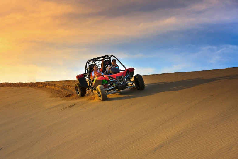 a group of people riding a buggy in the desert, vibrant red and green colours, oceanside, profile image, action sports