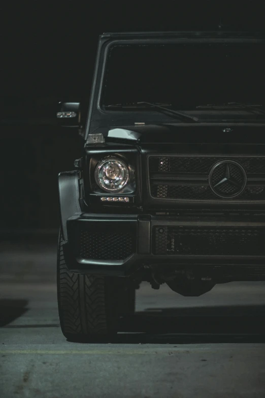 a black mercedes benz benz benz benz benz benz benz benz benz benz benz benz benz benz benz, trending on pexels, off-roading, illuminated focal point, from the waist up, indoor shot