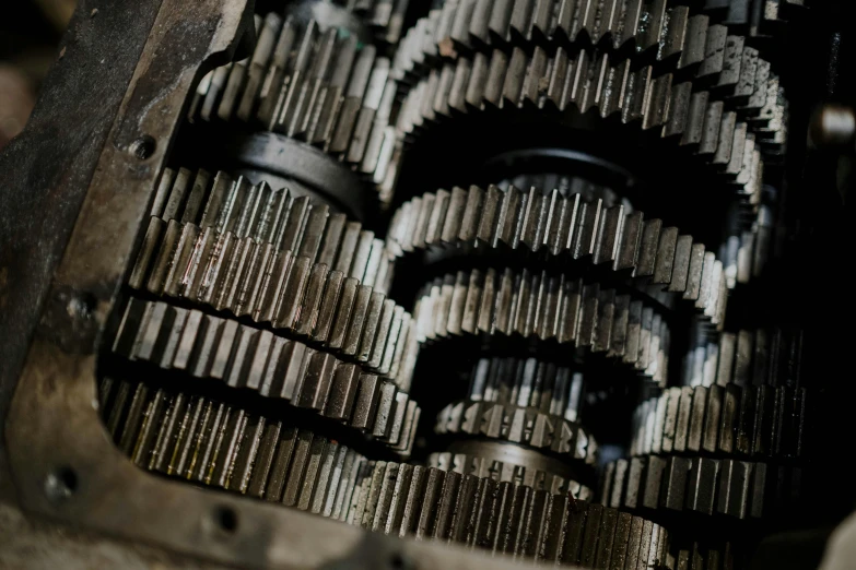 a close up of gears inside of a machine, a portrait, by Konrad Witz, unsplash, renaissance, fan favorite, closeup of car engine, high textured, high detail photo
