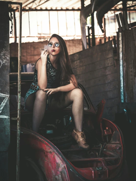 a woman sitting on top of a horse drawn carriage, inspired by Elsa Bleda, pexels contest winner, wearing dirty overalls, sexy look, mechanic, nongraphic