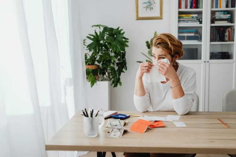 a woman sitting at a table with a cup of coffee, gum tissue, diy, woman crying, worksafe. instagram photo