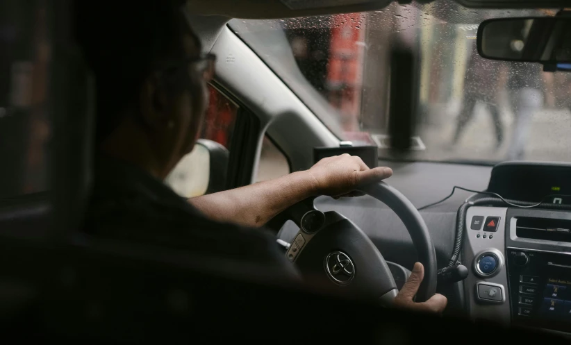 a man driving a car on a rainy day, pexels contest winner, fan favorite, rectangle, 4l, plain