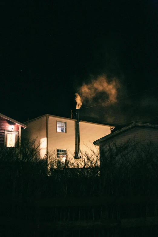 a building that has a lot of smoke coming out of it, inspired by Gregory Crewdson, pexels contest winner, taverns nighttime lifestyle, profile image, chimney, rinko kawauchi