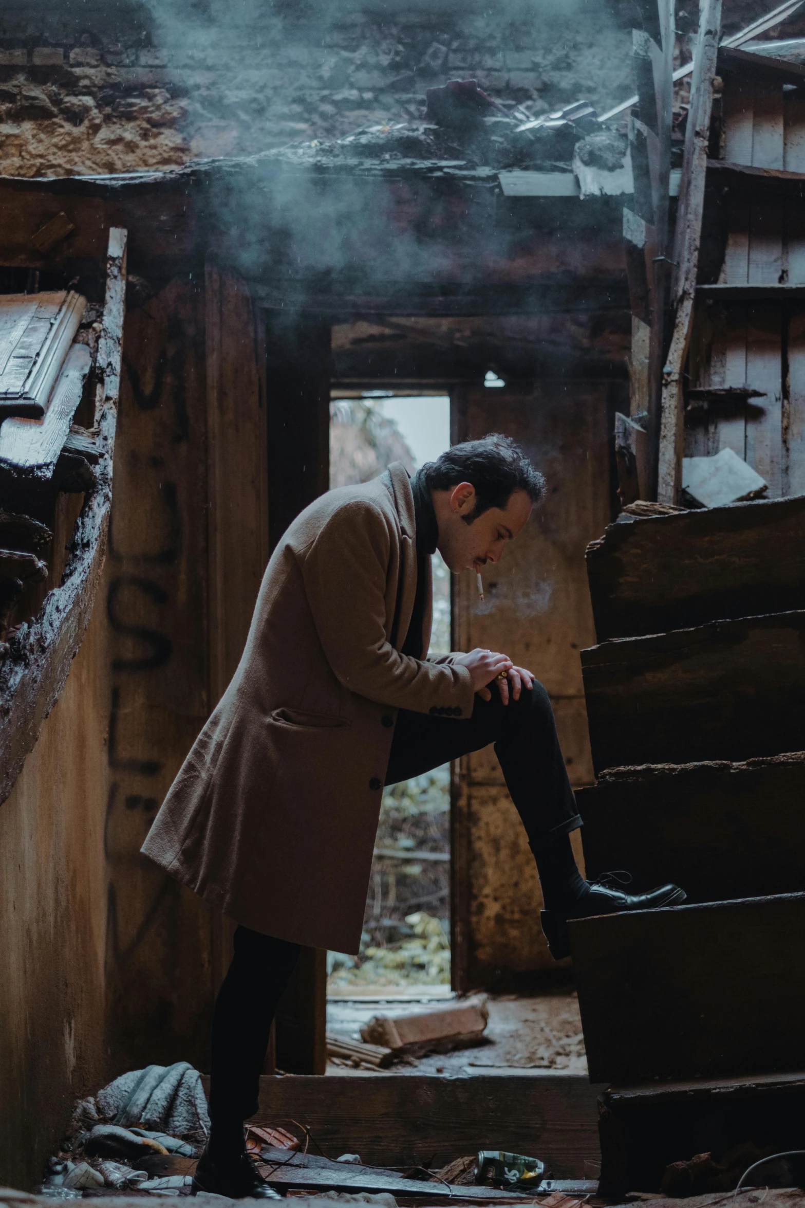 a man smokes a cigarette in an abandoned building, an album cover, pexels contest winner, romanticism, wooden stairs, ( ( theatrical ) ), heartbroken, robert sheehan