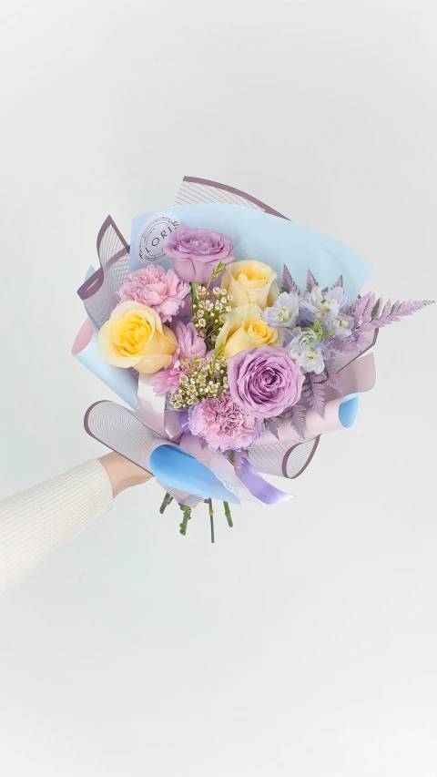 a person holding a bouquet of flowers in their hand, pastelwave, purple and yellow, light grey mist, front and center