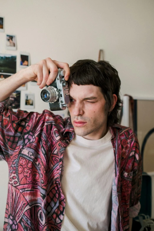 a man taking a picture of himself with a camera, unsplash, photorealism, declan mckenna, h3h3, taken in the late 2010s, non binary model