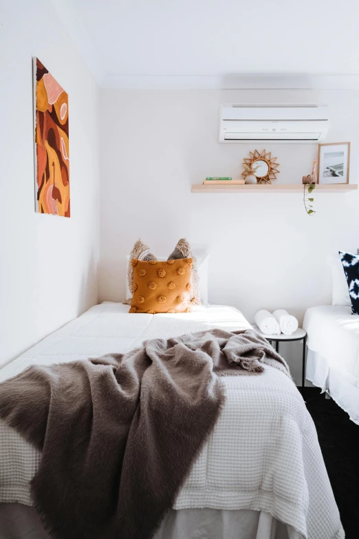 a couple of beds sitting next to each other, by Lee Loughridge, trending on unsplash, white walls, manuka, two suns, decorations