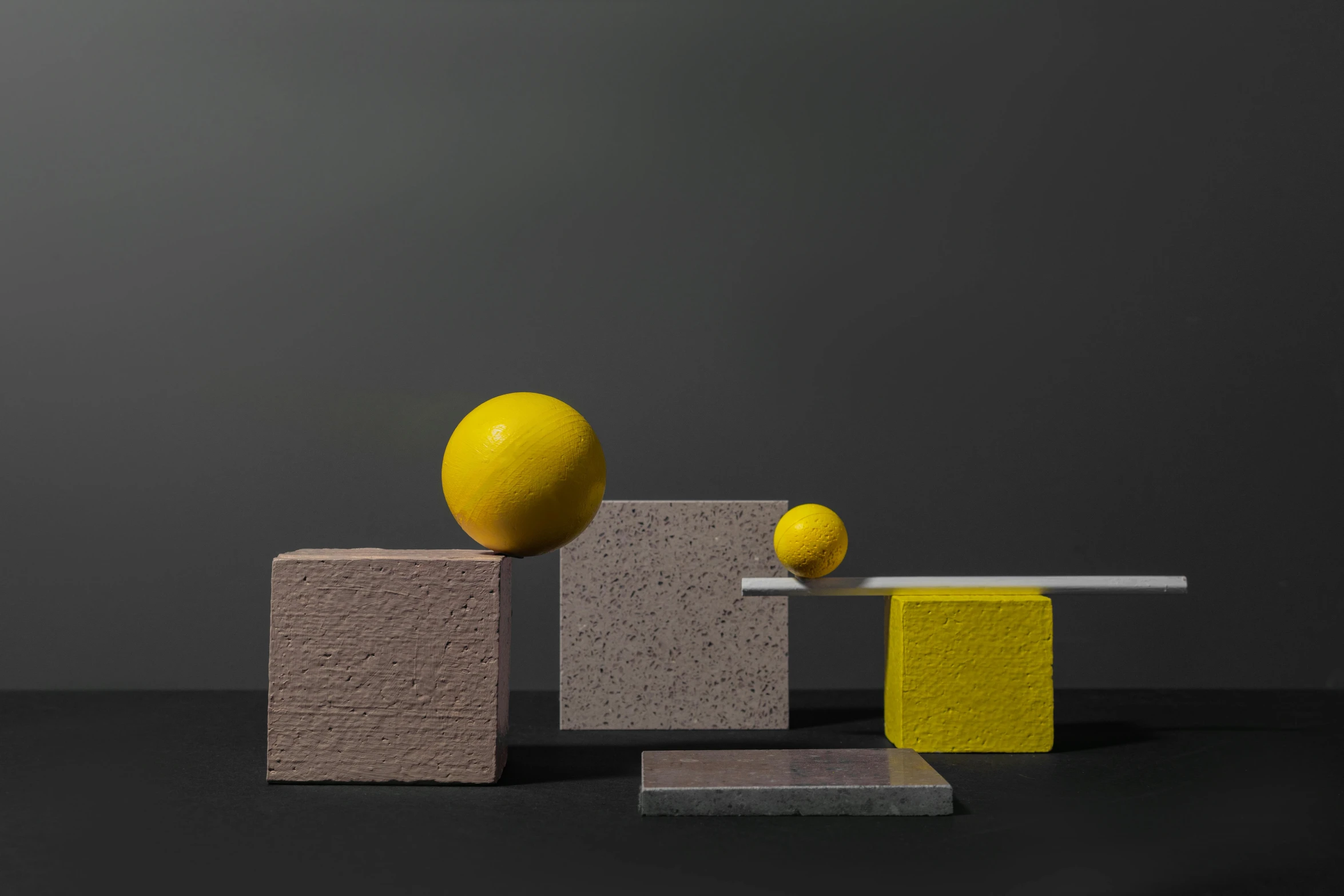 a yellow ball sitting on top of a block, an abstract sculpture, inspired by Bauhaus, pastel pink concrete, colors: yellow, blocks, still life