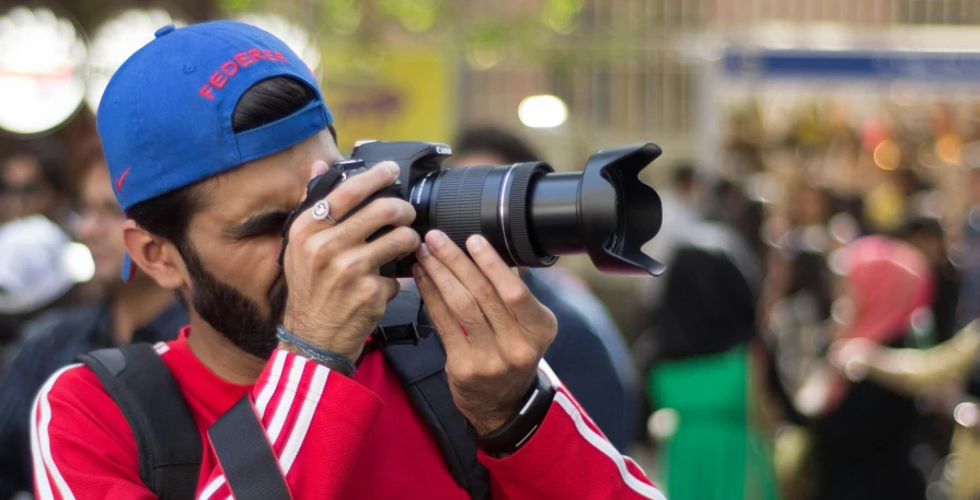 a man taking a picture with a camera, by Luis Molinari, amr elshamy, fan favorite, telephoto zoom, cover shot