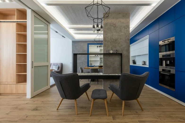 a room that has a table and chairs in it, grey and blue theme, eliran kantor, behance lemanoosh, wide high angle view