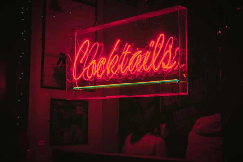 a neon sign hanging from the side of a building, pexels, cocktail in an engraved glass, reds), profile image, nighthawks