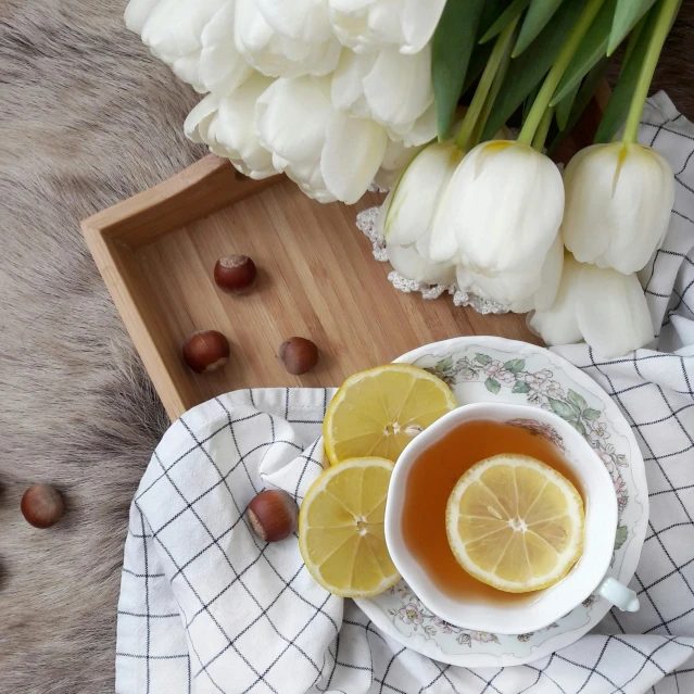 a cup of tea with lemon slices and nuts, inspired by Agnes Martin, pexels contest winner, romanticism, chrysanthemum and tulips, 15081959 21121991 01012000 4k, decoration, grid arrangement