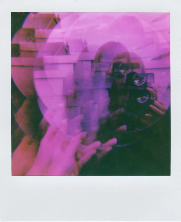 a man taking a picture of himself in a mirror, a polaroid photo, inspired by Elsa Bleda, pexels contest winner, holography, ((purple)), translucent neon, round format, pixilated