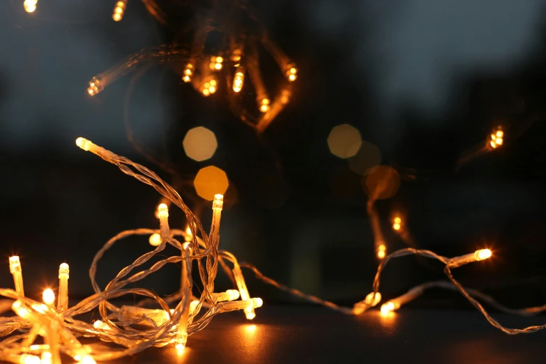 a close up of a string of lights on a table