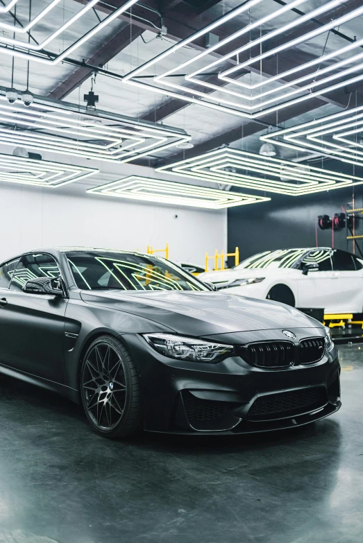 a black bmw car parked in a garage, inspired by An Gyeon, secret lab, multi chromatic, inside of an auto dealership, superdetail