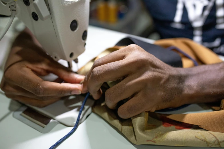 a close up of a person working on a sewing machine, inspired by Afewerk Tekle, close together, avatar image, tailored clothing, thumbnail