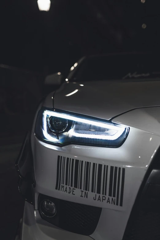 a close up of a car with a barcode on it, by Adam Marczyński, pexels contest winner, with cool headlights, white pearlescent, eyes projected onto visor, close up iwakura lain