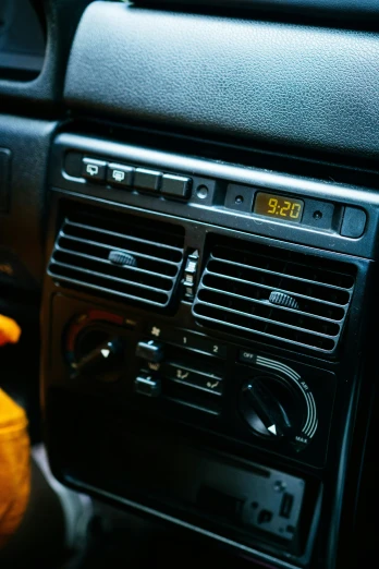 a close up of a dashboard of a car, an album cover, inspired by Elsa Bleda, unsplash, les automatistes, air conditioner, square, yellow, 90s photo