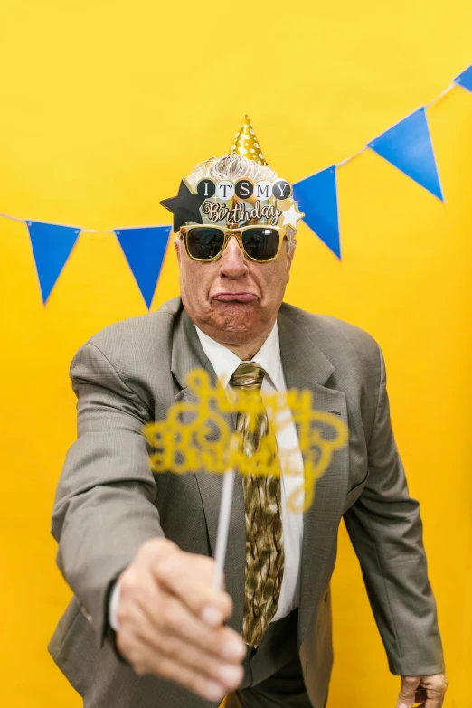 a man in a suit pointing at the camera, an album cover, inspired by Murray Tinkelman, party hats, wearing gold glasses, grumpy [ old ], profile image