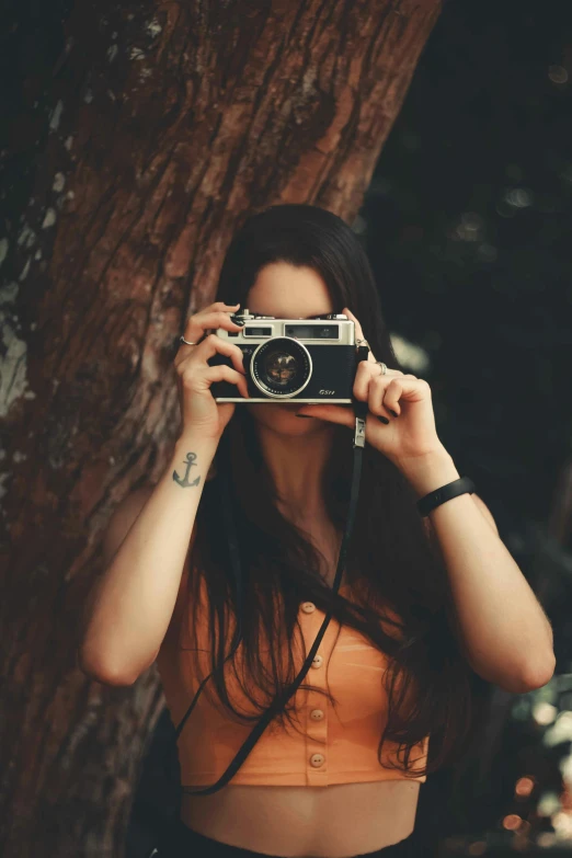 a woman taking a picture with a camera, inspired by Elsa Bleda, hipster, photohoot, photo pinterest, in retro colors