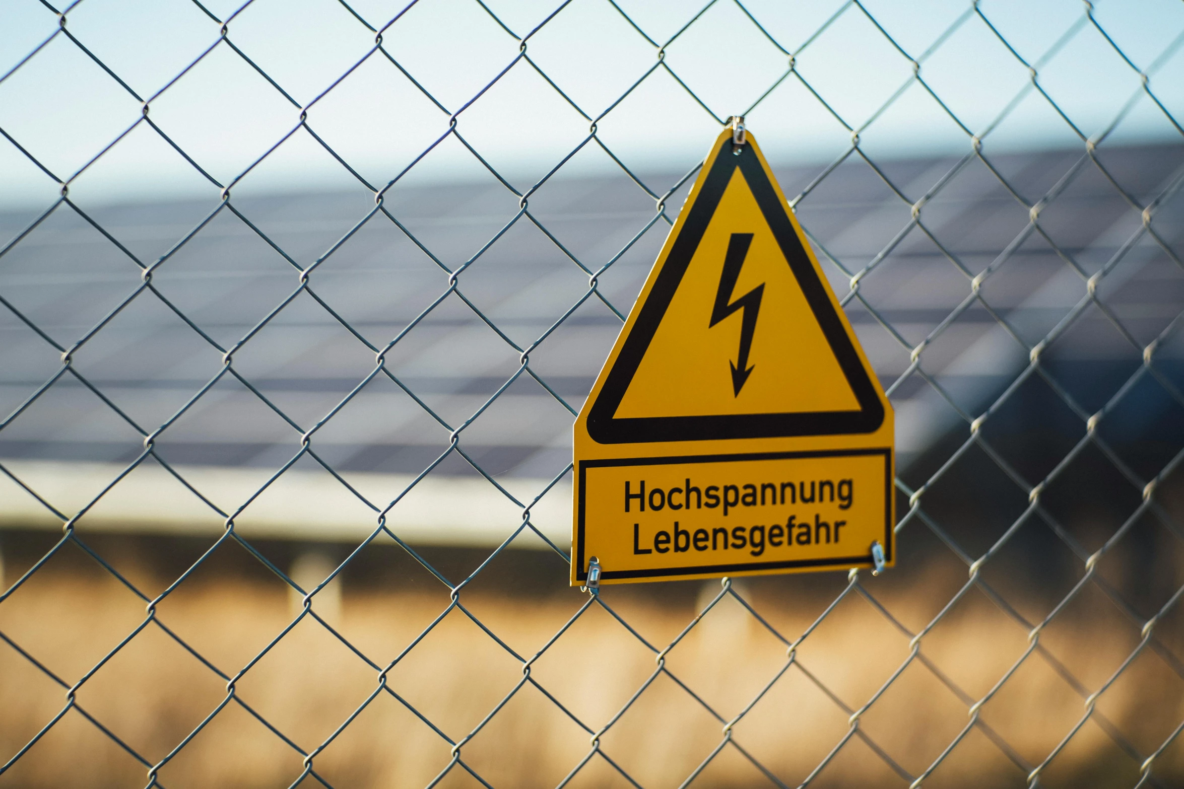 a close up of a sign on a chain link fence, a picture, by Jakob Gauermann, unsplash, high voltage warning sign, 15081959 21121991 01012000 4k, ilustration, scientific photo