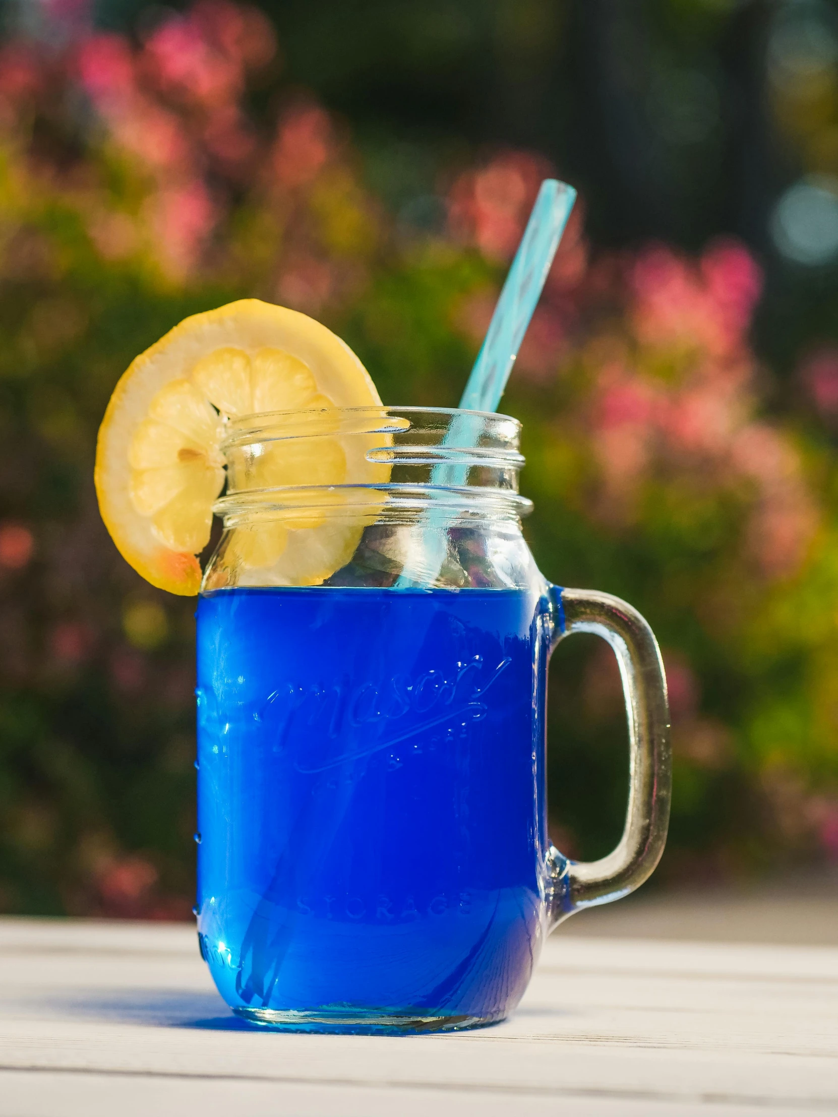 a mason jar filled with blue liquid and a lemon slice, pexels, ((blue)), square, may)