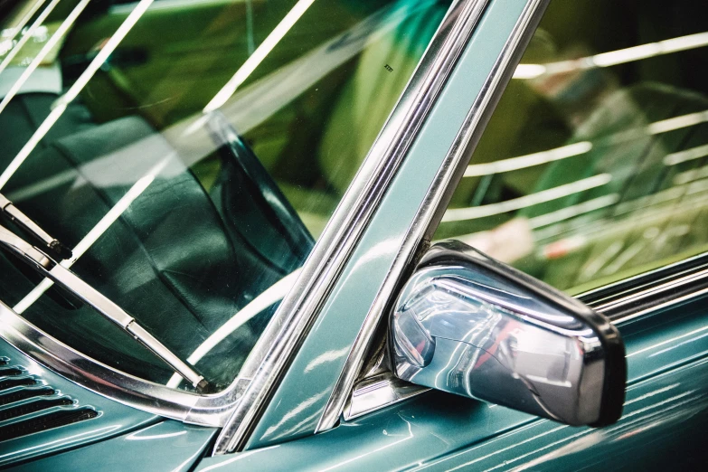 a close up of the side window of a car, by Carey Morris, pexels contest winner, green pickup car, avatar image, midcentury modern, festivals