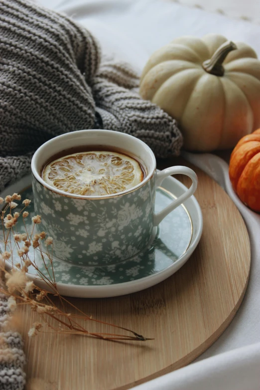 a cup of coffee sitting on top of a wooden tray, pumpkin, profile image, green tea, thumbnail