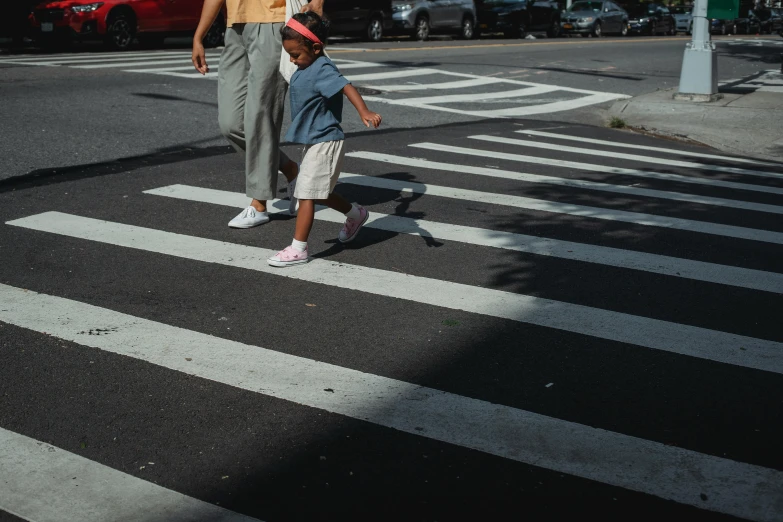 a man and a child crossing the street, pexels contest winner, square lines, low quality photo, thumbnail, schools