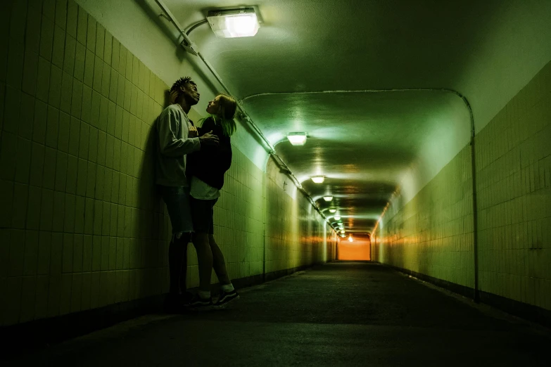 a couple standing next to each other in a tunnel, inspired by Nan Goldin, lesbians, couple kissing, taken in 2 0 2 0, teenage girl