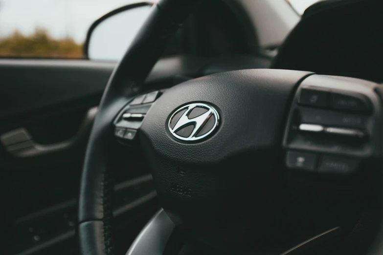 a close up of a steering wheel in a car, hydrogen fuel cell vehicle, instagram post, shot on sony a 7, inspect in inventory image