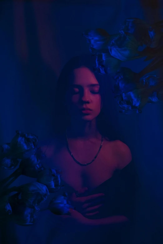 a woman in a black dress holding a bouquet of flowers, an album cover, inspired by Elsa Bleda, pexels contest winner, blue scales covering her chest, tessa thompson inspired, anna nikonova aka newmilky, purple dim light