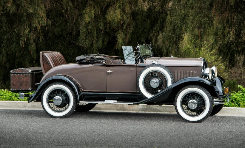 a vintage car parked on the side of the road, brown, flapper, lightweight but imposing, award-winning masterpiece