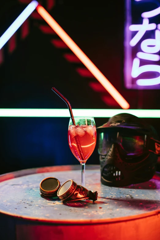 a glass of wine sitting on top of a table, red light saber, neon visor, cold drinks, bixbite