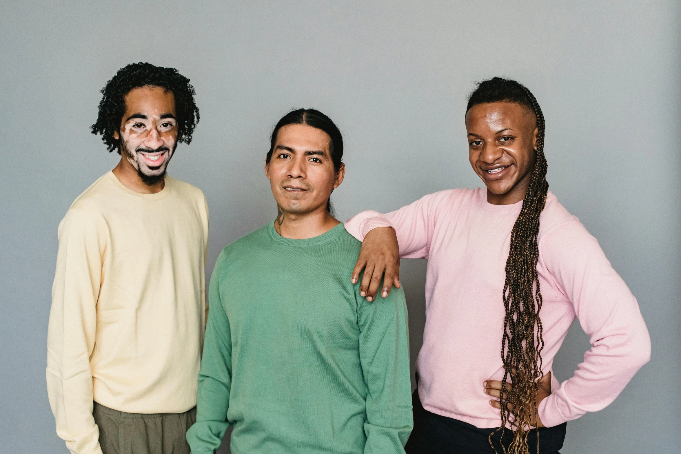 a group of three men standing next to each other, pexels contest winner, antipodeans, dreadlock breed hair, ( brown skin ), wry smile, chilean