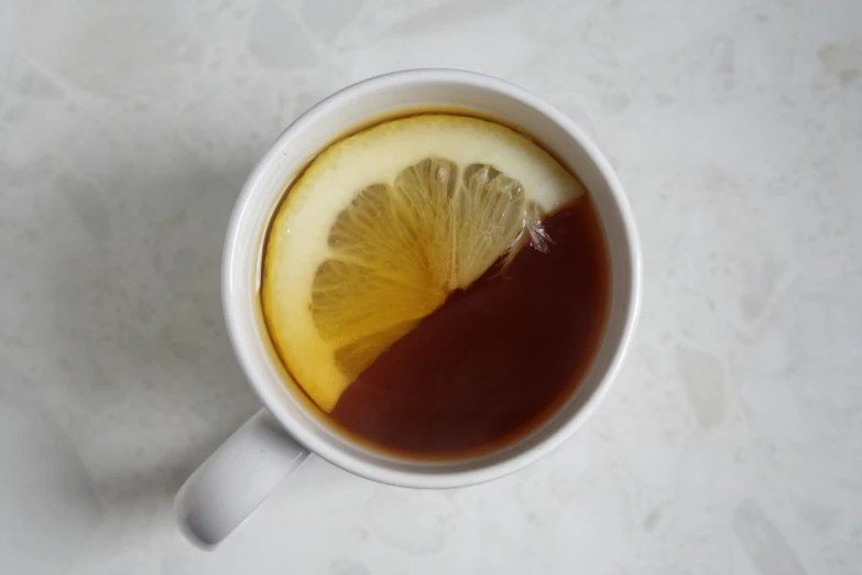 a cup of tea with a slice of lemon in it, unsplash, photorealism, circular, brown, fan favorite, portrait n - 9