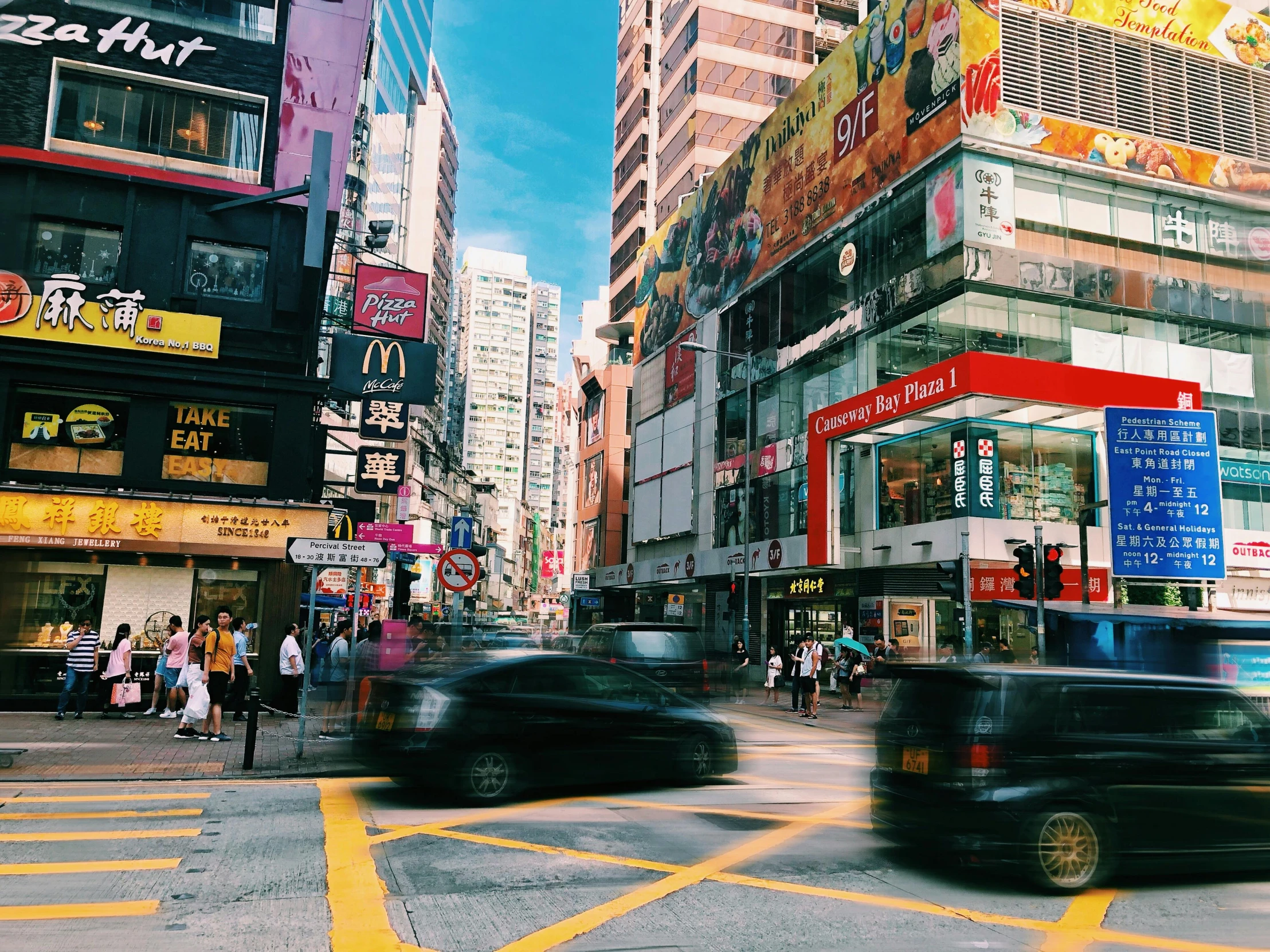 a busy city street filled with lots of traffic, an album cover, pexels contest winner, hong kong buildings, quirky shops, 90s photo, youtube thumbnail